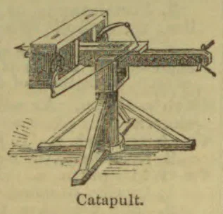 An old-fashioned catapult mounted on a wooden frame.