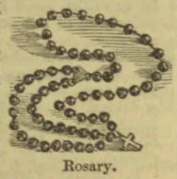 A rosary with a chain of beads arranged in loops and a cross at the end.