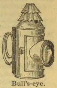 An illustration of a bull's-eye lantern with a projecting round lens and a loop handle.