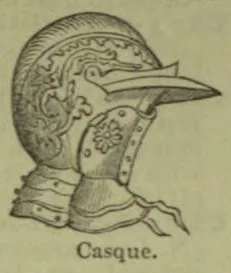 An ornate medieval helmet with a long projecting visor and neck guard.