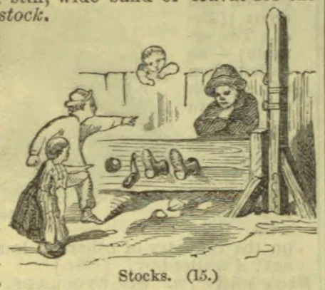 A man is restrained in wooden stocks while two people look on.