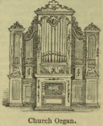 An ornate pipe organ with multiple banks of pipes and decorative woodwork.