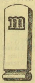 A tall upright stone marker bearing a lowercase letter m stands on a rounded base.