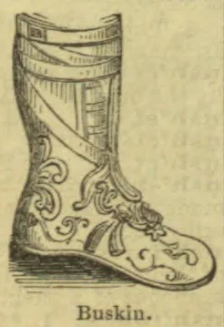 An ornate knee-high boot with decorative bands and scrollwork.