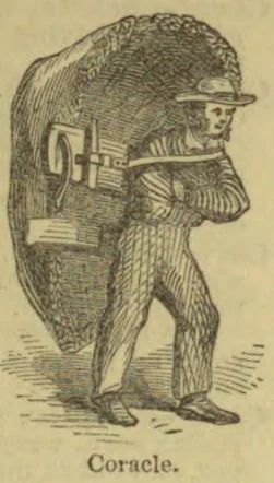 A man carries a large, rounded coracle on his back.