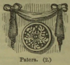 An ornate circular patera hangs beneath a draped swag with tassels.