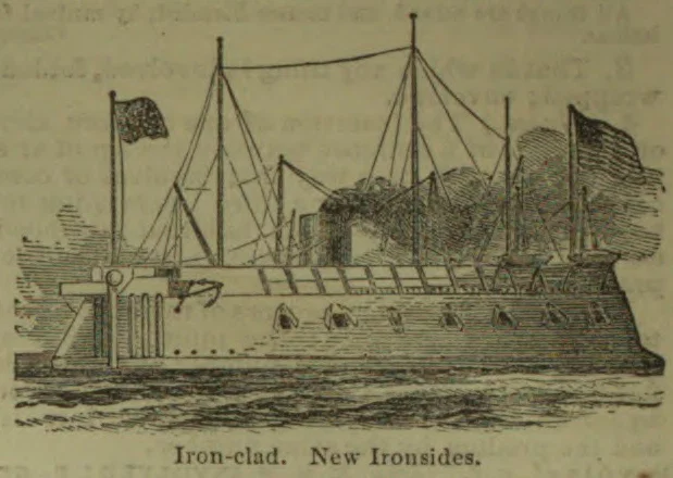 An ironclad warship with masts, rigging, flags, and gunports is shown at sea.