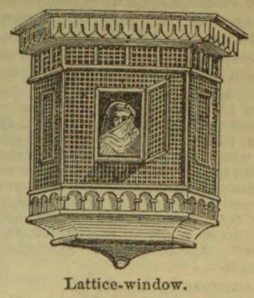 An ornate projecting lattice window with a small framed portrait in its center.