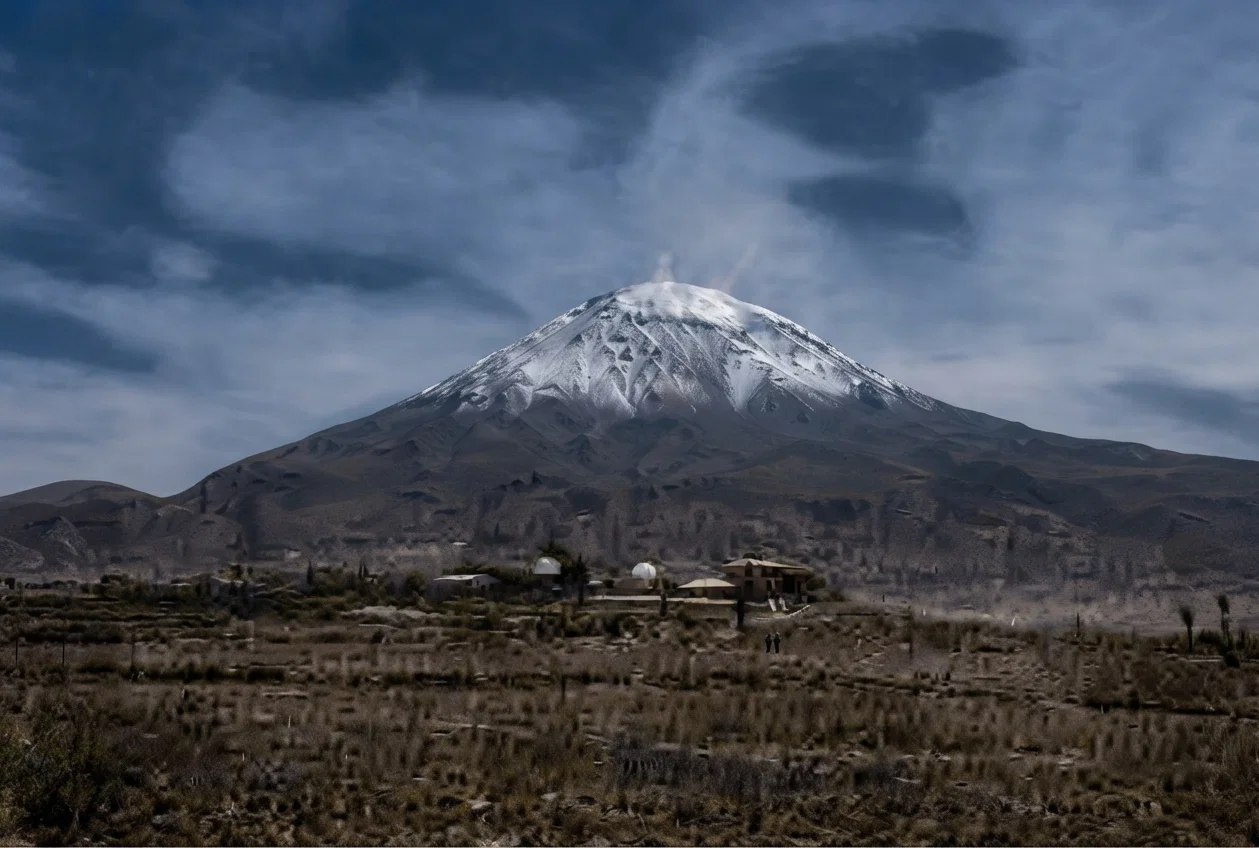 Southern station of the Harvard Observatory, Arequipa, Peru, El Mista in the background. The mountain is 19,200 feet high; the observatory, 8,050, the highest in the world. One station is maintained, we believe, at 13,400 feet, and another at 15,700 feet. See also cut on previous page.
