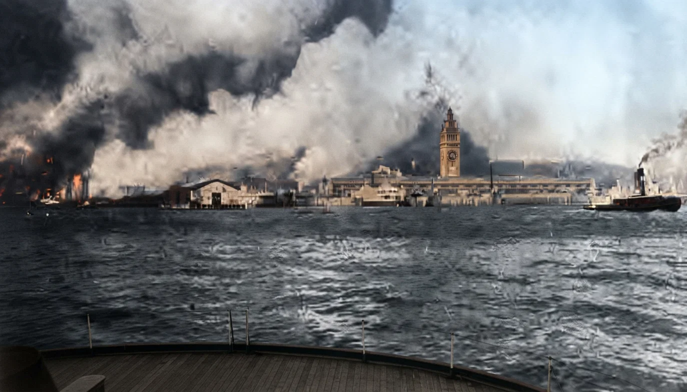 A view from the ferry-boat Berkeley on its way from Oakland to San Francisco, taken the morning of the earthquake when the fire had well started. The tall tower is the center of the Ferry Building, the fire tug at the right.