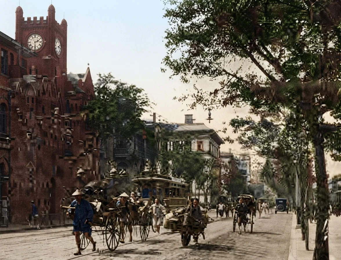 A View on the Shanghai Bund. Note the well-paved street, and also the wheelbarrow load of baggage.