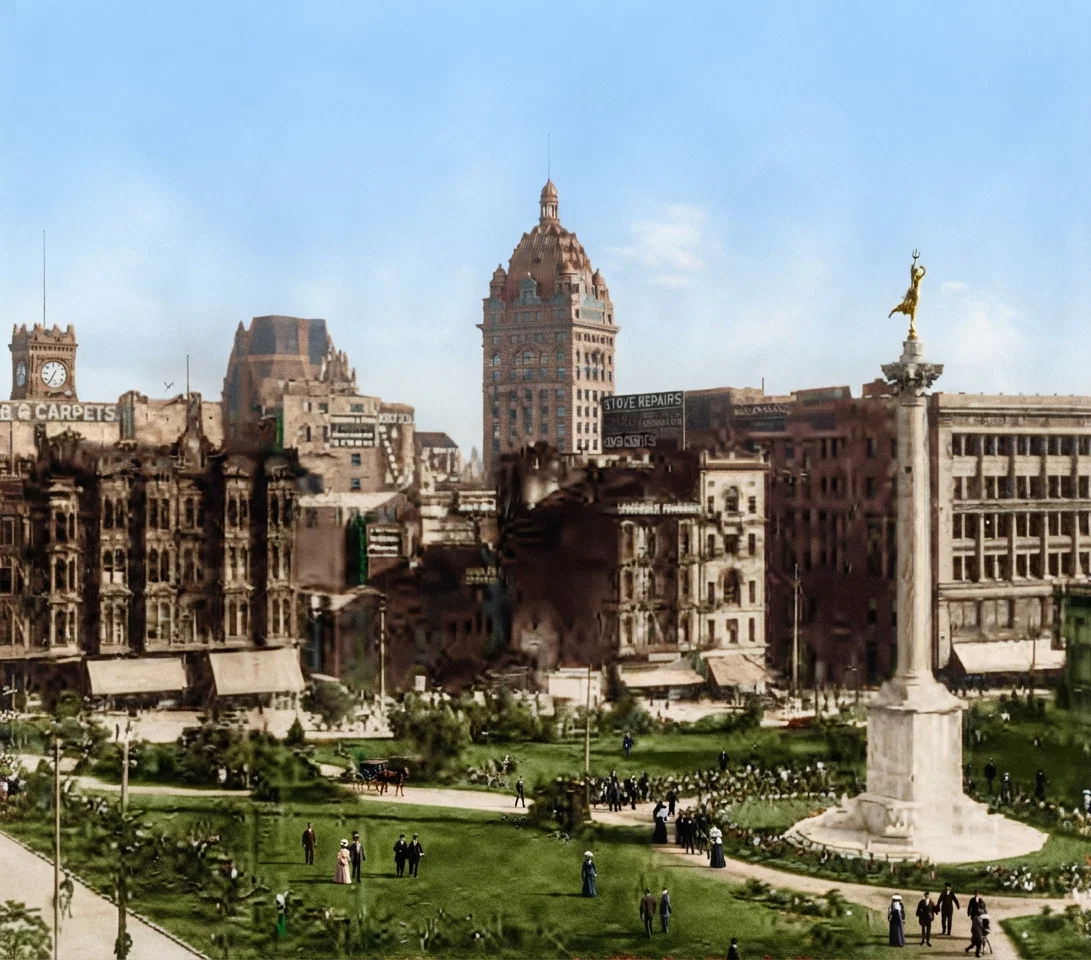 A view in San Francisco from Union Square, taken before the fire. The high building on the left with the clock tower is the Chronicle Building. In the center stands the tall Call Building. The high building between hides the Examiner Building shown on the opposite page.