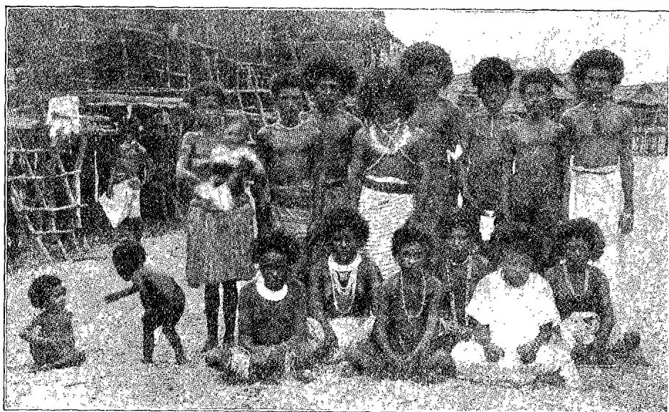 GROUP OF NATIVES AT HANUABADA VILLAGE, NEW GUINEA