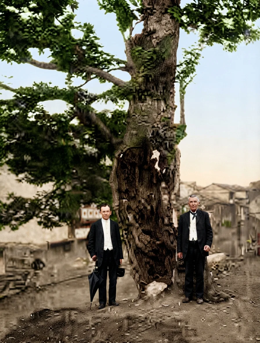 Curious old tree, at Nansiang, China. The wood has all decayed away, leaving only the bark. Yet the tree stands, and the leaves are as green as on any other. Elder R. C. Porter at the right, Elder O. A. Hall at the left.